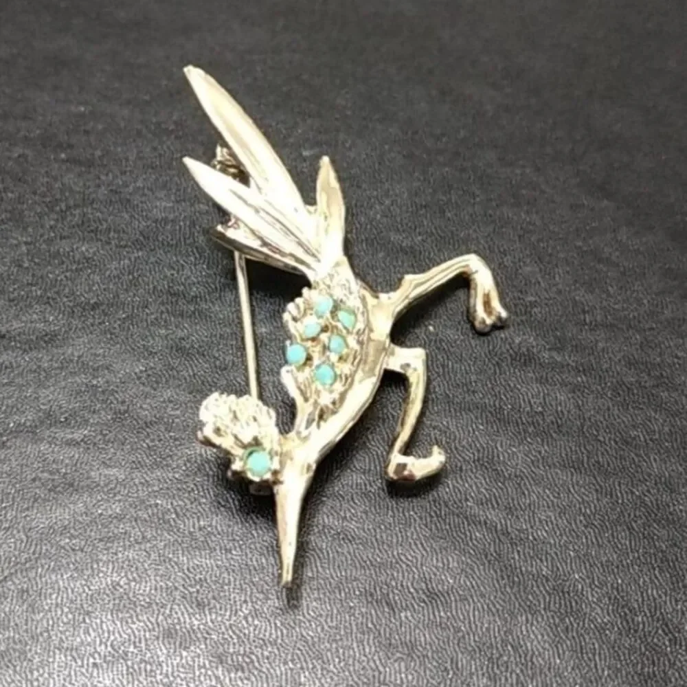 Silver tone vintage roadrunner brooch.
